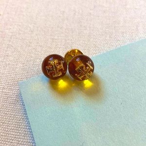 Tory Burch Stud Earings. Gold logos with amber ball. Gently used.